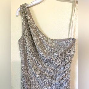 Long formal dress with a subtle silver lace that hugs your body comfortably.